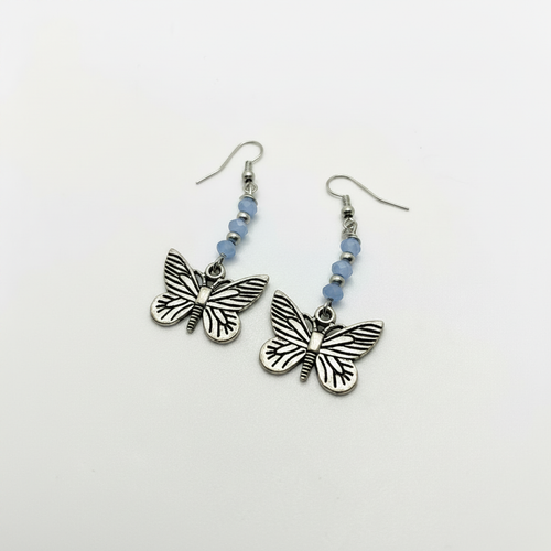 Butterfly dangle earrings with silver butterfly charms and light blue faceted beads